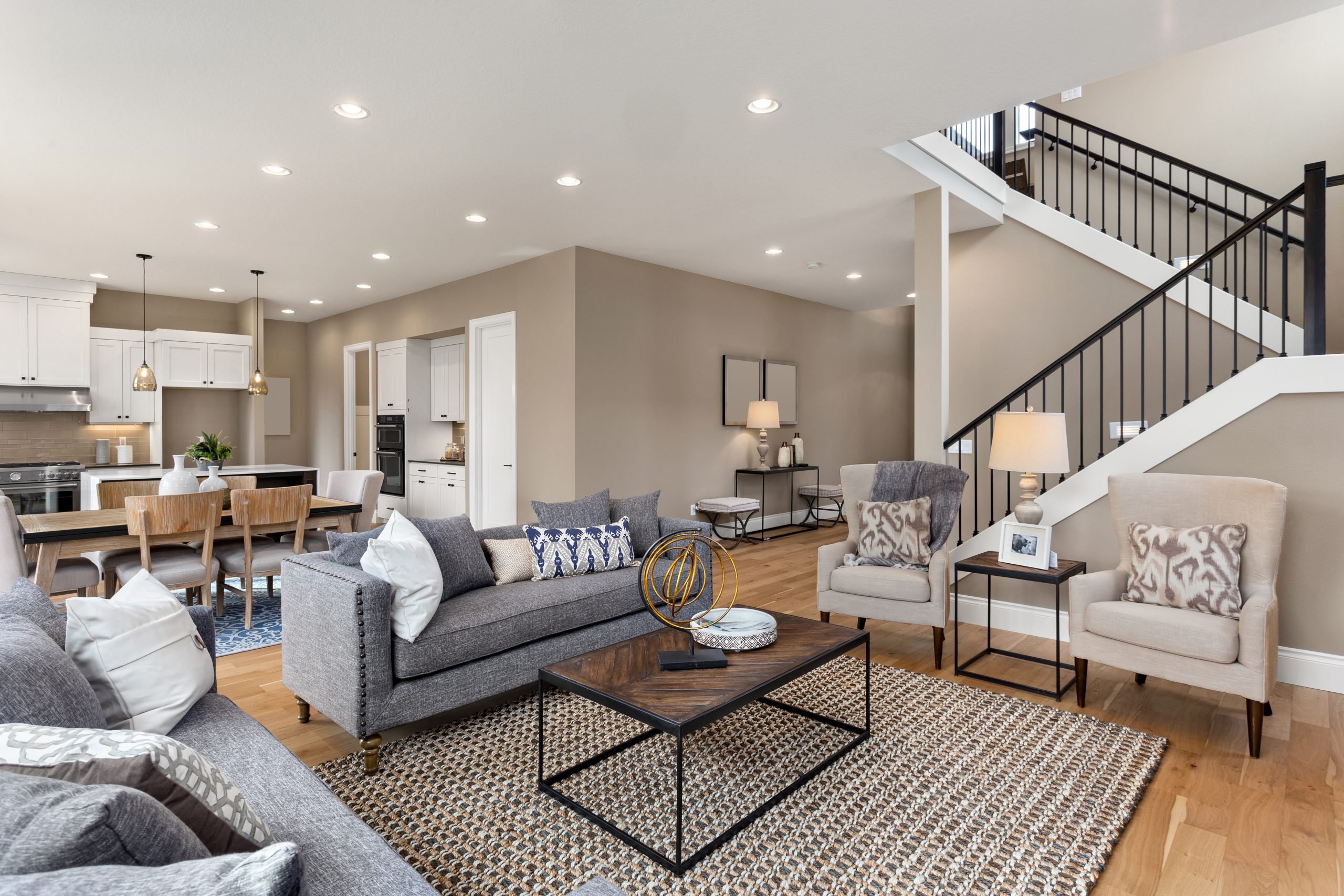 Living room and kitchen interior in new home with open concept f