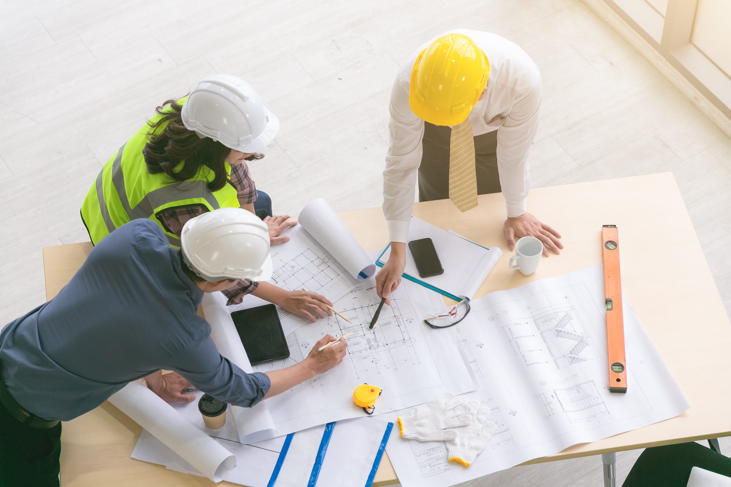 Team of engineers and architects working, planing, measuring lay